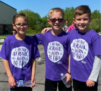 three boys smiling